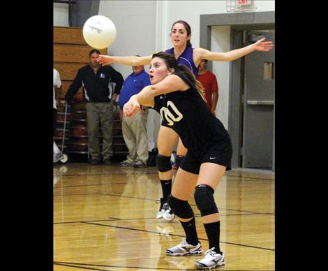 Lady Viking Brooke Doty plants her feet to grab a dig.