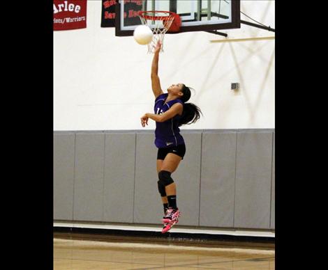 through the air with an aggresive serve