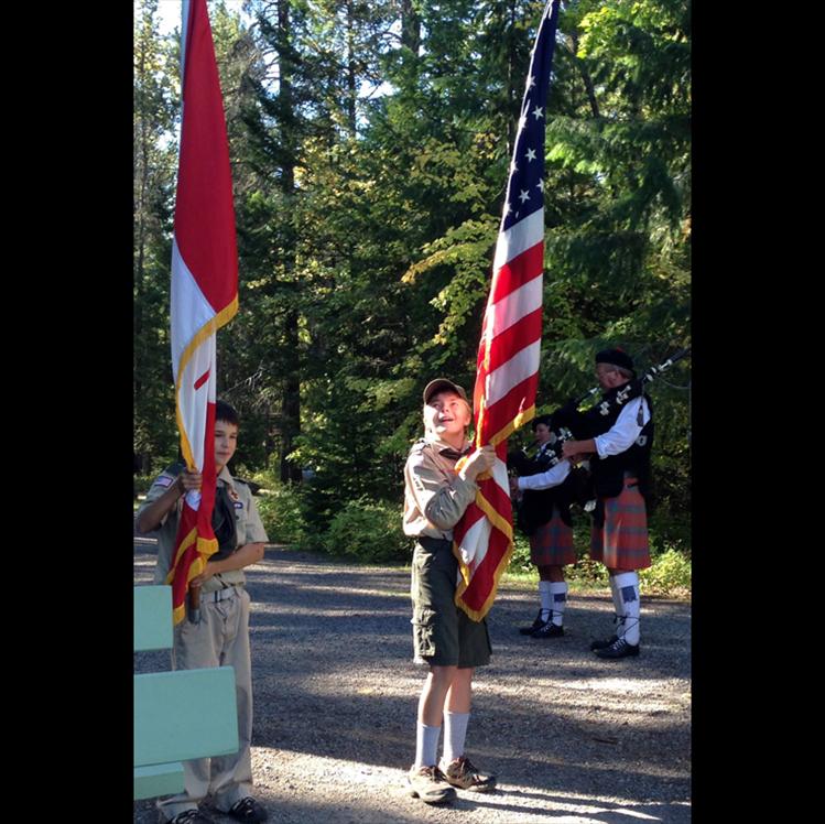 Boy Scouts Ethan McCauley and Brody Soderquist from Troop 1945 served as Color Guard for the Hands Across the Border ceremony held annually by the Waterton-Glacier International Peace Park Assembly on Sept. 21, held in Glacier Park this year. Also participating in the ceremony from Polson were Dick and Sandy Bratton, who played the bagpipes for the opening and closing of the  ceremony.
