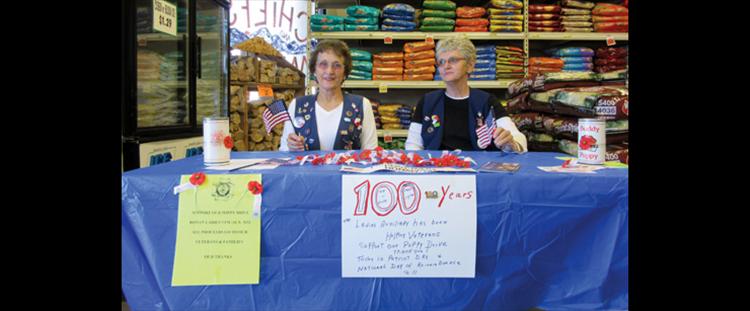 Margaret Fay and Carolyn Streets, representing the VFW Ladies Auxiliary 5652 of Ronan, hold a poppy drive Sept. 11 in honor of Patriot Day and the National Day of Remembrance of 9-11 and celebrating 100 Years of Helping Veterans from Sept. 17, 1914 to Sept. 17, 2014. At their Sept. 10 meeting, members were given 100 year pins and celebrated with a commemorative cake. 