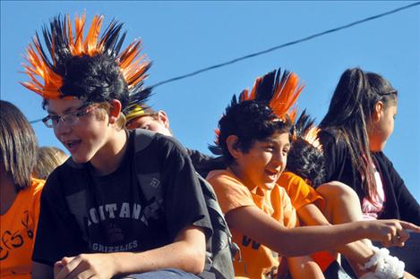 Students don mowhawks to show their school spirit in the Ronan Homecoming Parade.