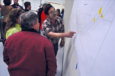 Ronan Mayor Kim Aipperspach shows members of the Ronan City Council map of a proposed access control plan for the expansion of Highway 93. 