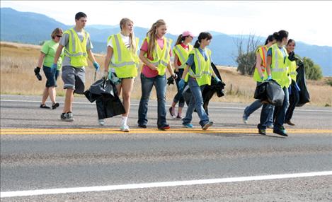 Mission High School students cross the highway to clean up the other side of their two-mile stretch.