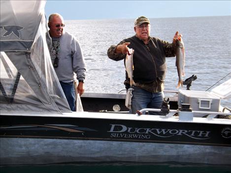 courtesy photo  Dan Smith and Jim Hoover pull lake trout from Flathead Lake as part of the Fall Mack Days fishing contest. 