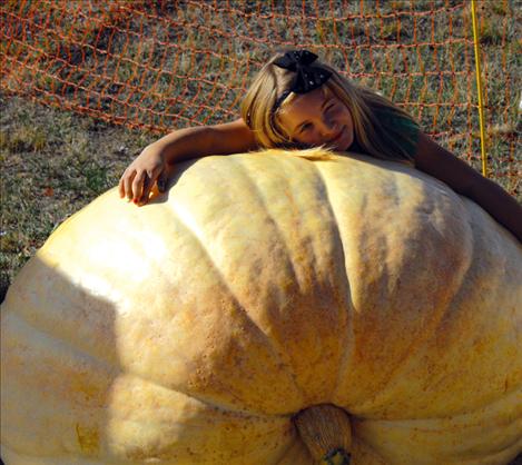 on’t know what to do with a giant pumpkin? Try hugging one like this girl.