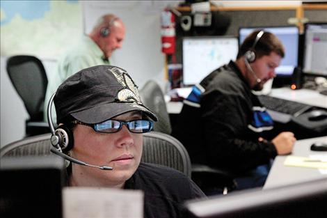 Dispatchers Shelly Wheeler-Burland, left, Devin Wegener and Keith Deetz work a shift in the Lake County Dispatch office.