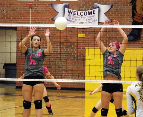 Lady Pirates Haley Fyant and Taylor Brackey guard the net in Thursday’s home game.