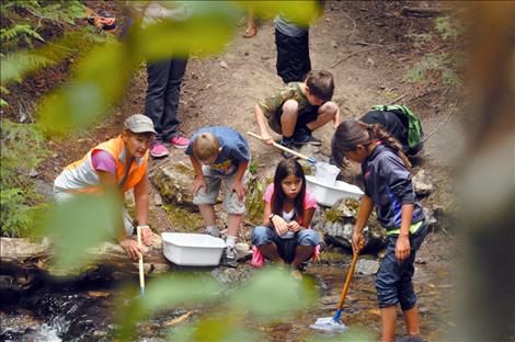 Teacher Carolyn Pardini teaches students in Crow Creek on a recent field trip. 