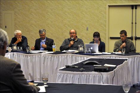 Montana Reserve Water Rights Compact Commission Chairman Chris Tweeten negotiates with leaders of the Confederated Salish and Kootenai Tribes.