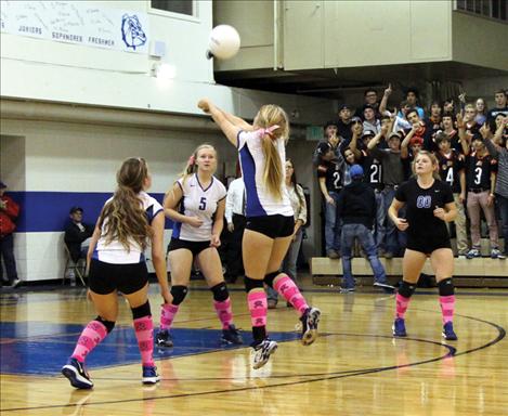 Lady Bulldog Jordyn Eichert scoops up ball in Thursday’s contest against Ronan.