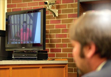 Galen Hawk appears in court from the Lake County Detention Center via closed video.