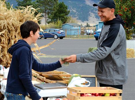 Michael Mohler, 13, sells apples.