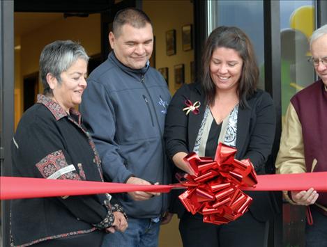 Salish Kootenai College Board of Directors members JoJo Ducharme, left, Jim Durglo, chair, Jody Perez and Bob Fouty are on hand for the ribbon cutting of the Highway Construction Training Programs building.