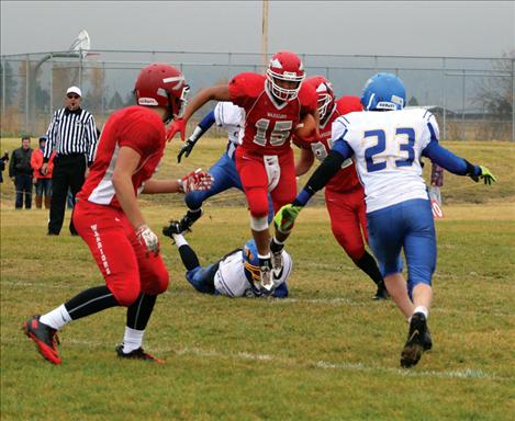 Patrick Big Sam busts through Great Falls’ defense in Saturday’s playoff game.