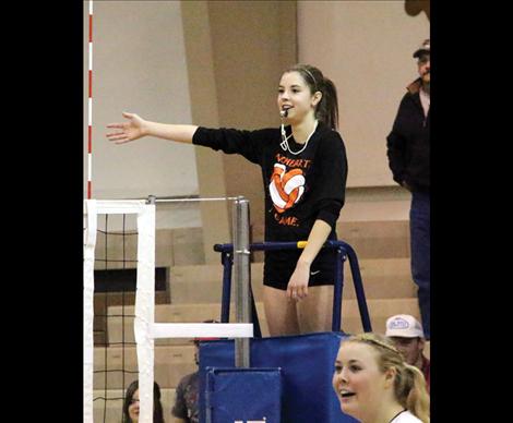 Maiden Sydnee Clairmont officiates during players vs. coaches match.