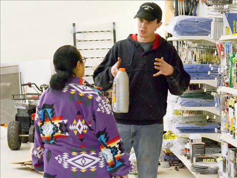 Clay McCready helps a customer find the right item.