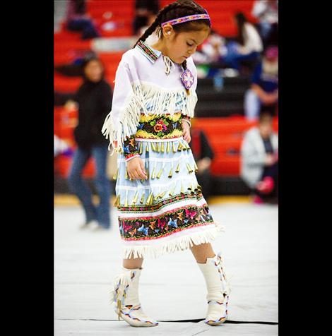 Rayna Tonasket dances in colorful regalia Friday at the Headstart Powwow in Ronan.