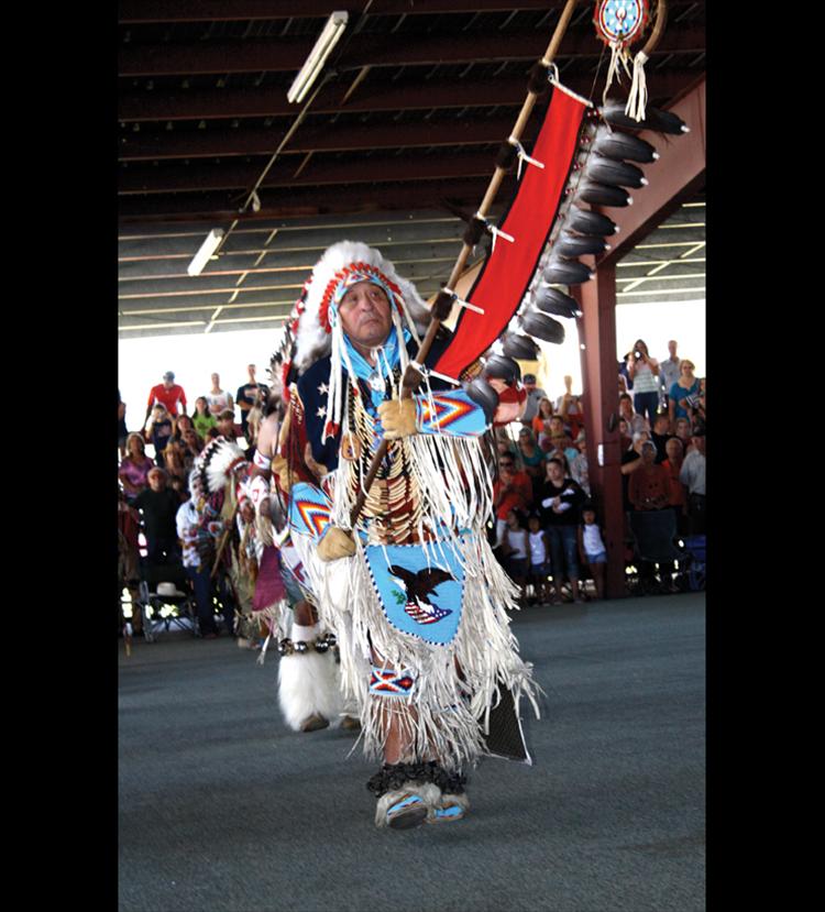 Head male dancer Kenny McClure leads the snake dance.