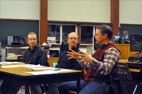 Charlo school board trustees Reece Middlemist and Dave DeGrandpre talk with Principal Steve Love about possibly accepting transfer students. 