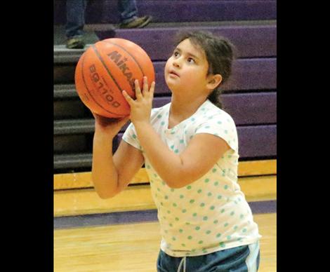 8 year old Dominique He-Crow eyes up her shot at Sunday’s Elks Hoop Shoot.
