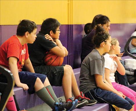 Competitors wait patiently while listening to contest rules.