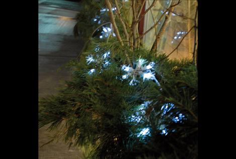 One of last year’s entries in the Celebrate the Season of Light glows in the December dusk.