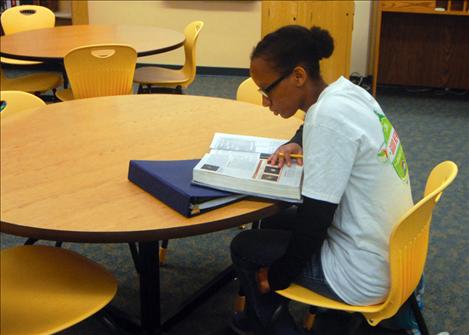 Naima Crowl studies in the PHS library during CORE/Flex time.