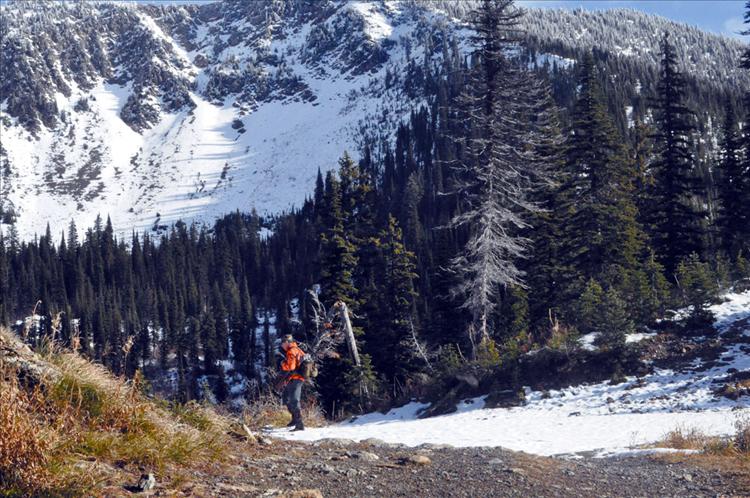 A hunter hikes through Jewel Basin on a recent sunny day. He reported that he saw several bucks that day, but didn’t feel like shooting any because it was such a beautiful day. The trails in the basin were covered in snow, but hikers and hunters were out in droves enjoying the chilly winter wonderland. 