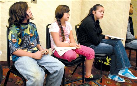 Students from Nkwusm, the Salish Immersion School, listen to the water rights discussion.