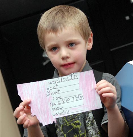 Kindergartner Troy Pierce shows off a poem about Montana.