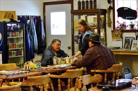 Judy Morton serves lunch to customers at The Biscuit, where people can find good food and unique Christmas gifts.