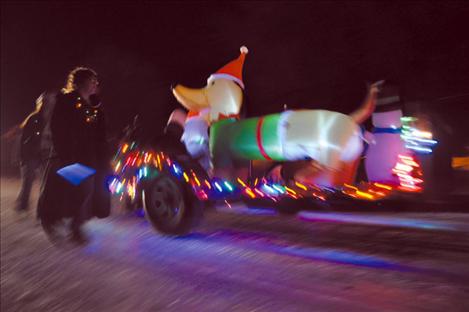 The Paul family float rolls in the Arlee Parade of Lights.