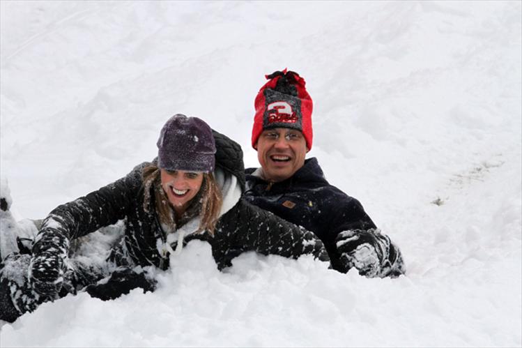 Laura and Shawn Burland enjoyed a recent afternoon of sledding with their children at Polson’s golf course. Nearly a foot of fresh powder enticed several families to enjoy a snowy day outdoors.