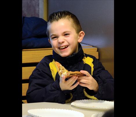Sawyer Pule, 7, enjoys lunch at Cornerstone Pizza in St. Ignatius.