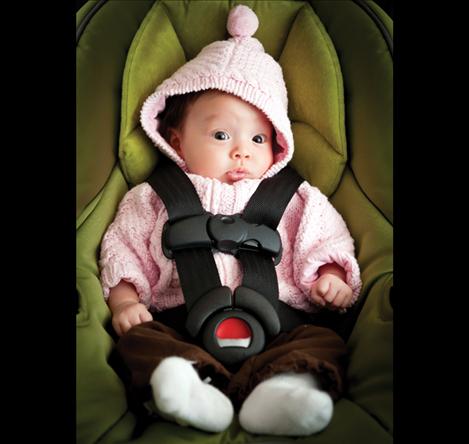 Strapping a child into a car seat while dressed in bulky winter clothing may interfere with proper function of the harness.