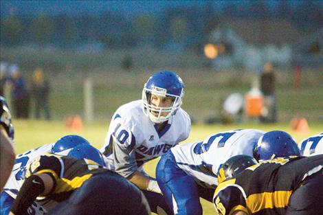 Quarterback Dylan Evans calls out orders before the snap during Mission’s homecoming game against Deer Lodge Friday. The Bulldogs won, 15-6.