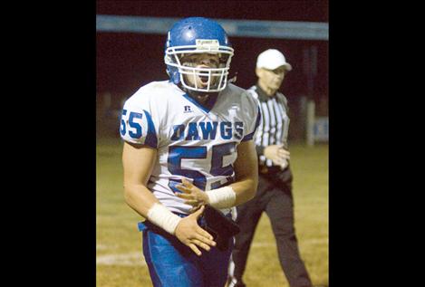 Senior Nikko Alexander yells in celebration after making a tackle during Mission’s Friday night football game. 