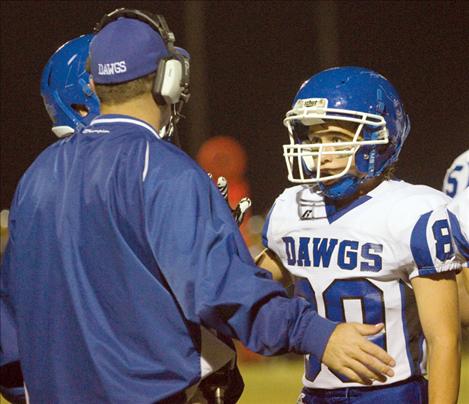 Steven Bravo listens to pointers from head coach Rich Ferris.