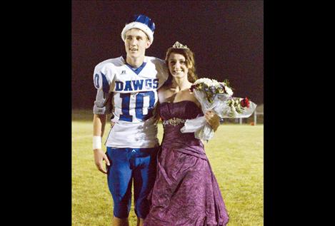Dylan Evans and Sara Nerby smile after being crowned Mission’s homecoming king and queen.