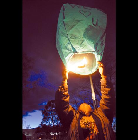 Adria Green launches a remembrance lantern for her brother John Pierre, Jr. as the jury deliberates if the man who killed him should be held accountable. 