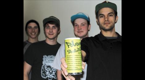 Jesse Vargas holds up one of the many donation cups sent out to local businesses. Vargas, along with committee members Jayson Pichler, Bradley Pichler and park user Thomas Wallace, met to discus ideas.