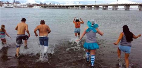People wore hats, tutus and even wings over their swimsuits as they jumped into Flathead Lake.