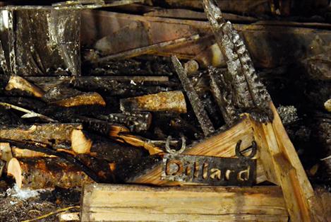 A metal sign with Val’s last name is found in the charred remains of the home