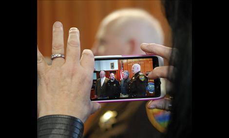 Val Bell  focuses on County Attorney Steve Eschenbacher, Detention Officer Lonnie Erickson, Justice of the Peace Randal Owens and her husband, Sheriff Don Bell, after the Lake County elected officials were sworn into office on Jan. 29. 