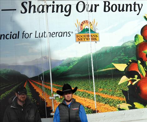 Greg Patton, left, Montana Foodbank Network, receives $1,000 worth of hamburger from the Western Montana Stockgrowers Association. WMSA Director Kyle Middlemist, right, helped load the beef at White’s Wholesale meats Jan. 14.