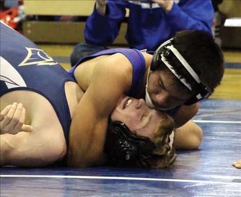 Bulldog Trent Dennison pins his challenger. Dennison went undefeated at the Bulldogs home hosted tourney.