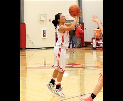 Scarlet Becca Whitesell sets up from three-pointer territory.