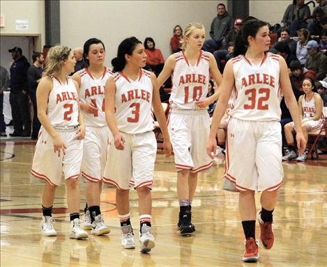 Scarlets Ella Lindburgh, Morgan Malatare, Becca Whitesell, Carly Hergett and Bryndle Goyins strut onto the court — a strut well deserved as the Scarlets have dominated their conference all the way to first place in the tough District 14-C.