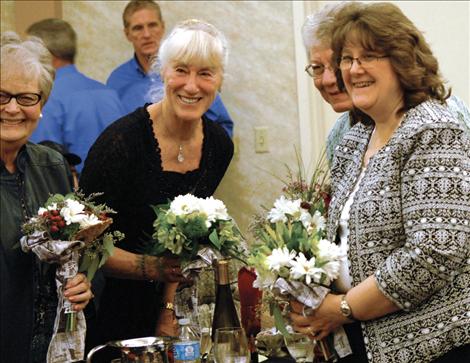 Berl Tiskus/Valley Journal Western Montana Cattlewomen former presidents Jean Patton, left, Pat Binger, Delene Tufly and Terri Middlemist receive bouquets as they are honored at the Western Montana Stockgrowers Association winter meeting on Jan. 24.