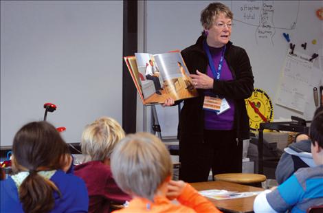 Cindy Willis reads to Pablo Elementary Schools students.